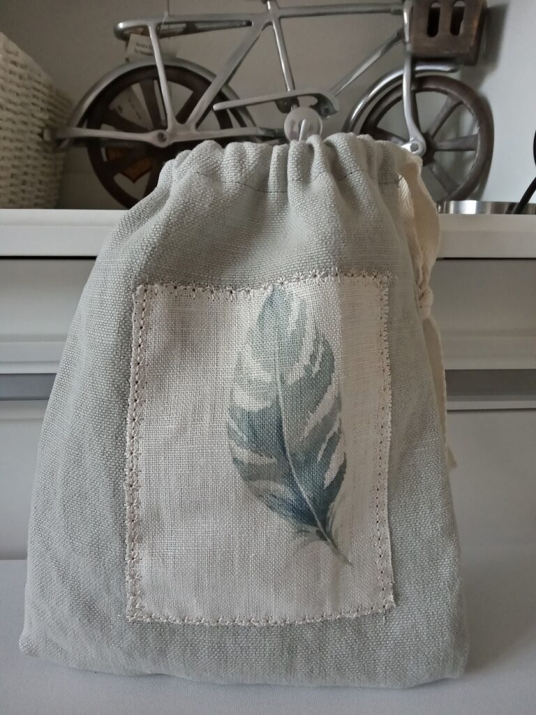 Isinmi Designs Drawstring Bag with Feather